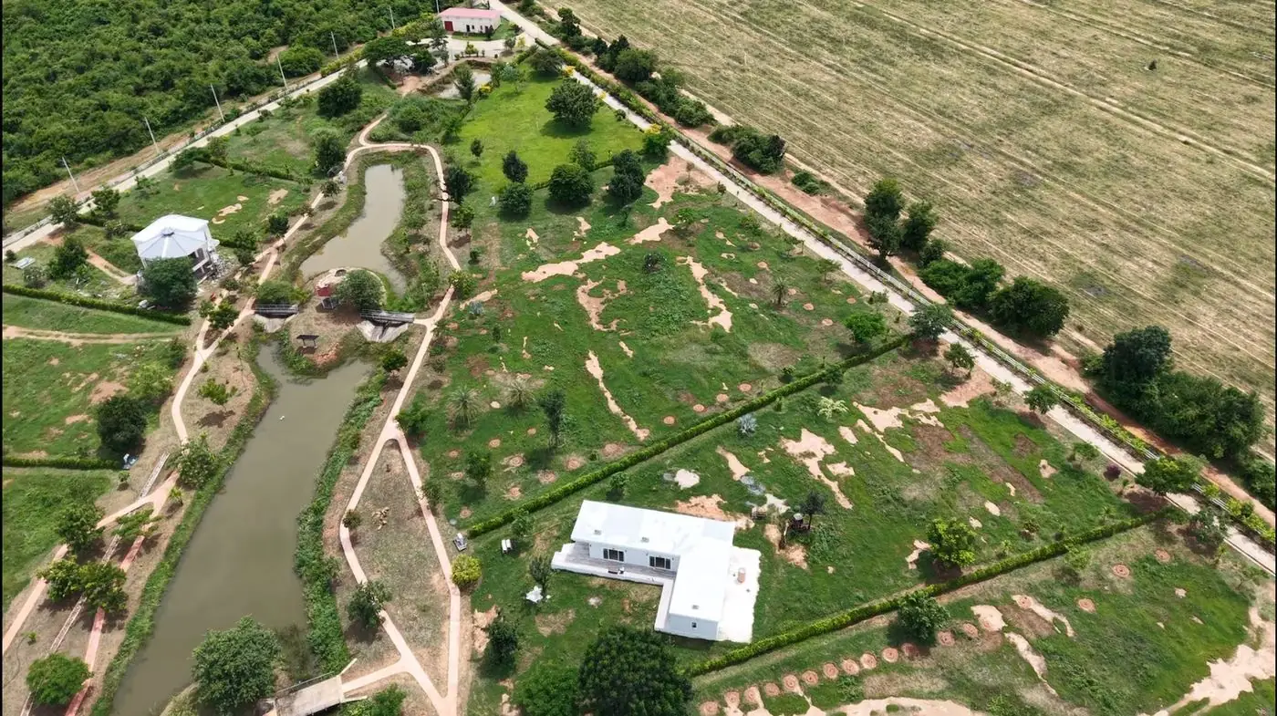 Wide aerial view of Natural Healthy Village and the surrounding Phetchaburi countryside