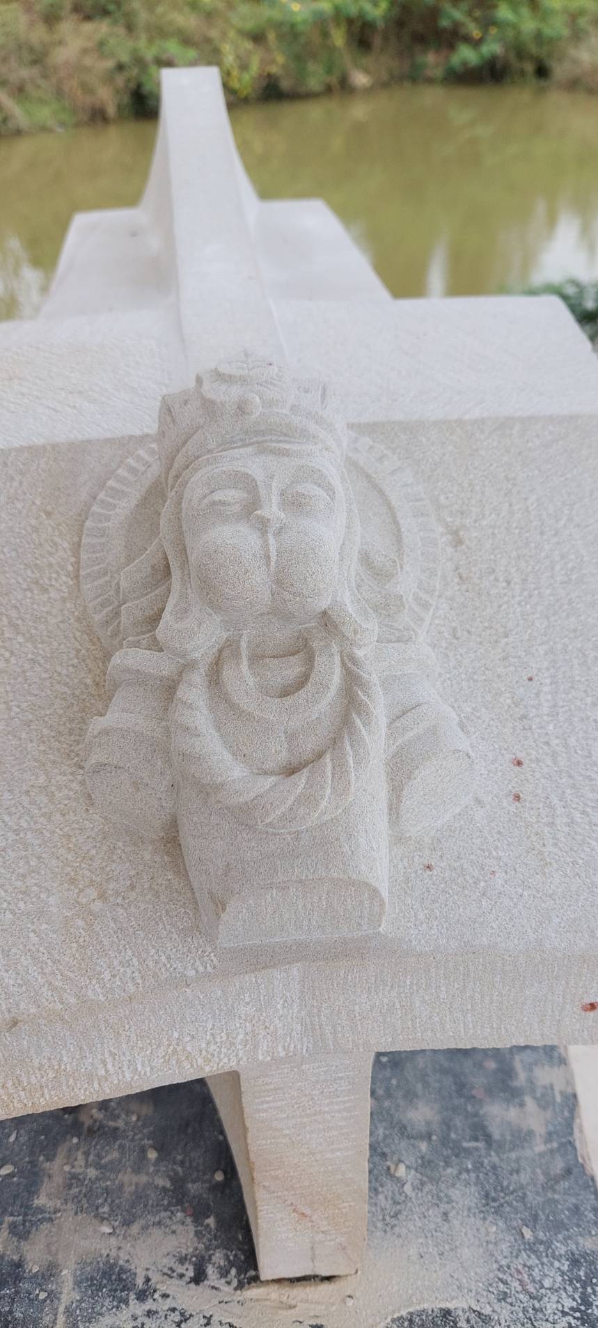Carved head of Hanuman on a chapel keystone