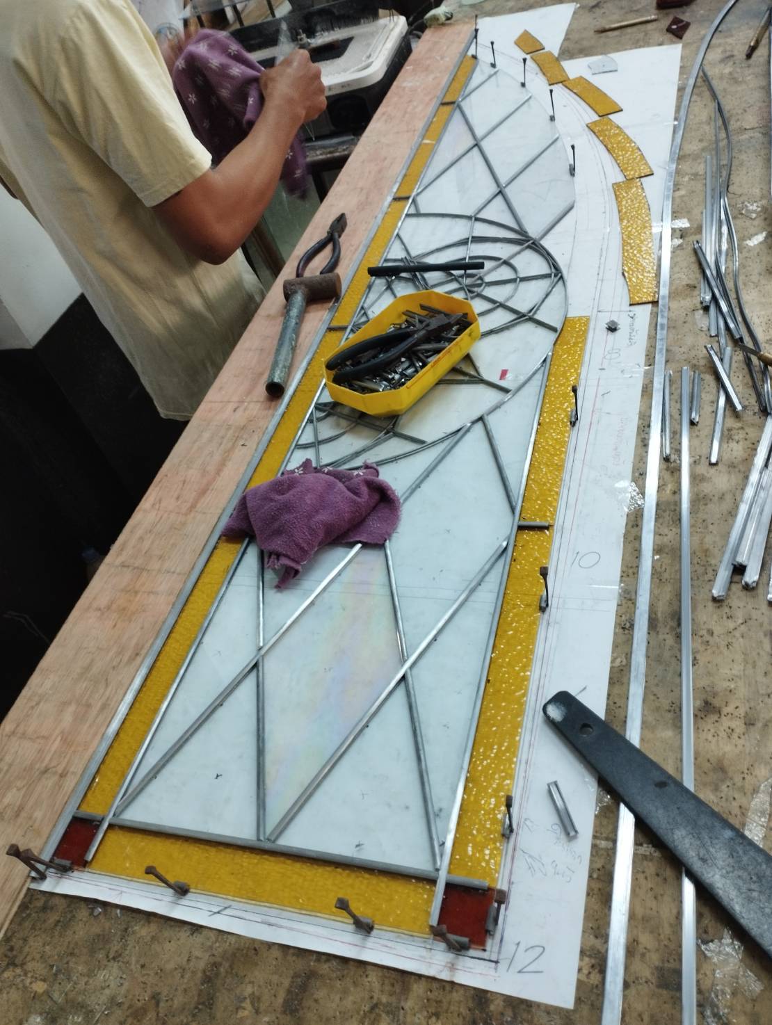 Stained glass of the master builder key under construction